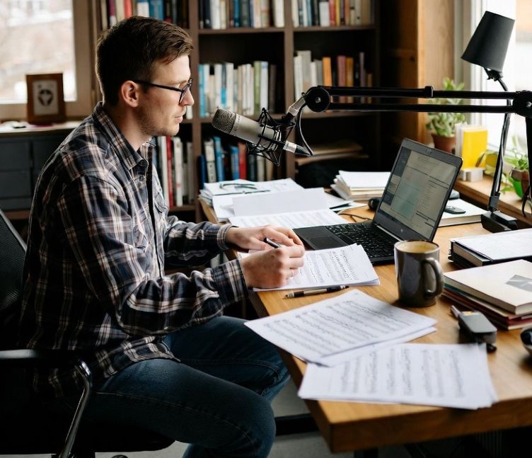 artist writing music at organized desk